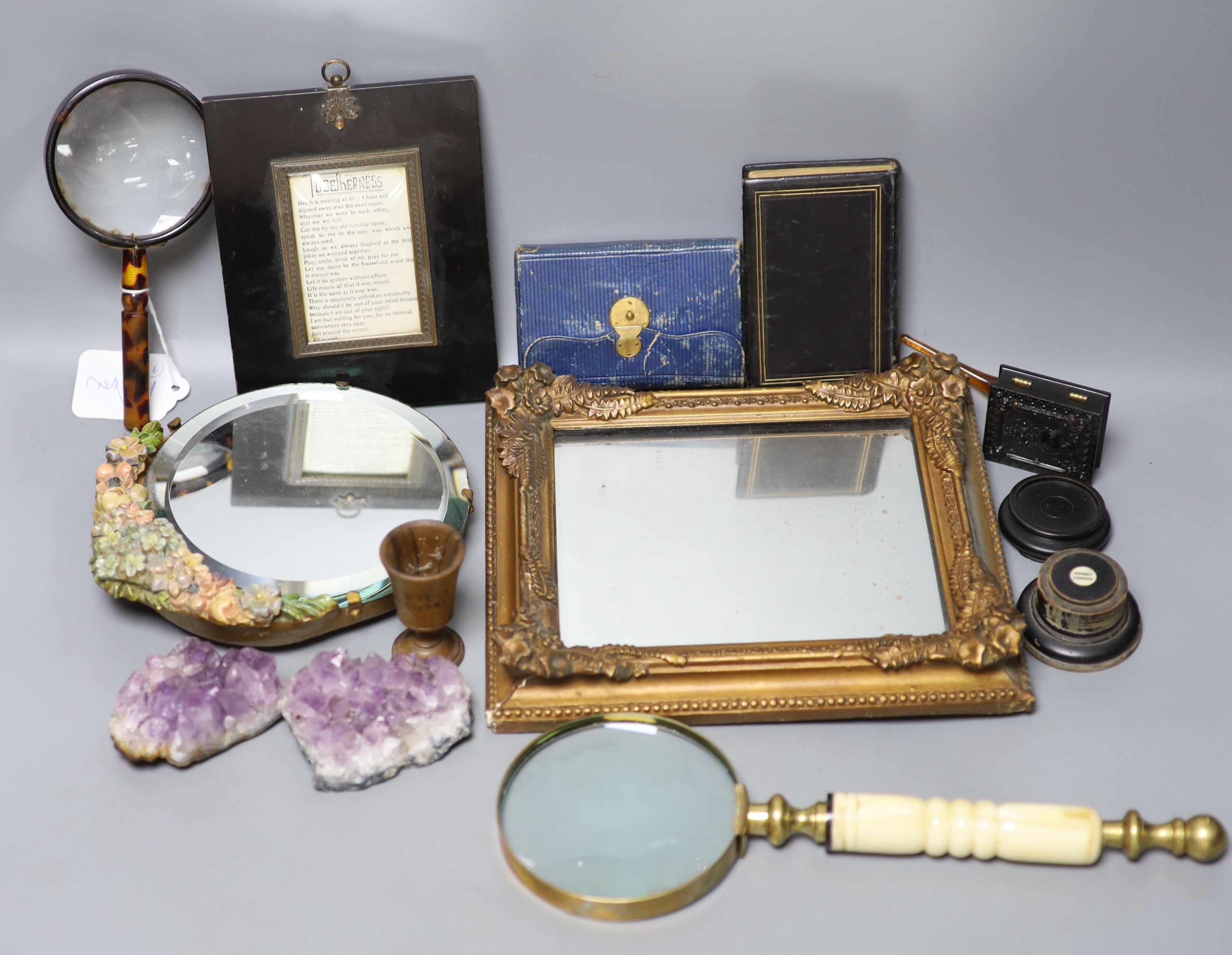 A group of objects of vertu, various frames, magnifying glasses etc.